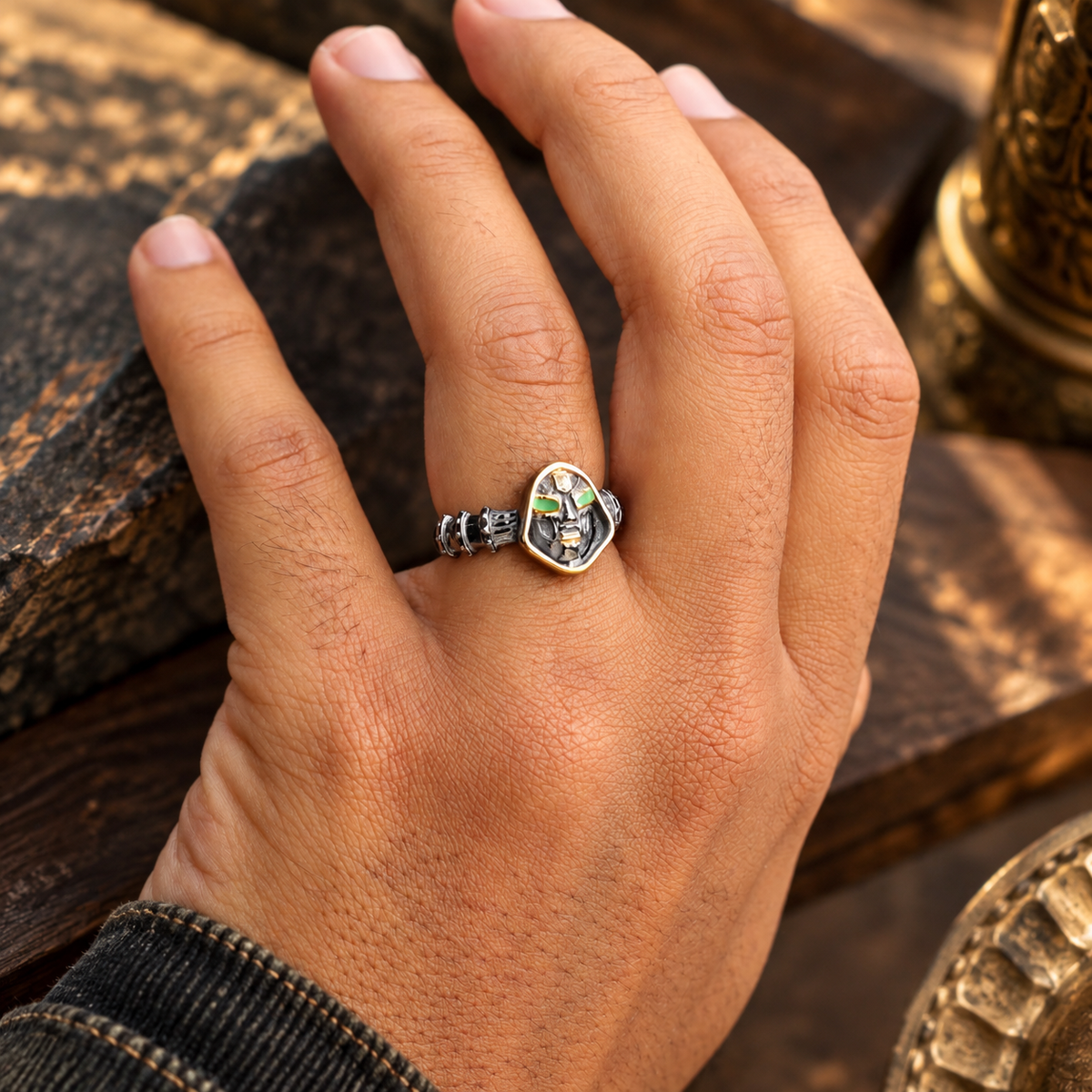 Doom Mask Ring with green eye accents, gothic detailing and industrial design. Bold men’s statement ring for punk, biker and dark fantasy style.