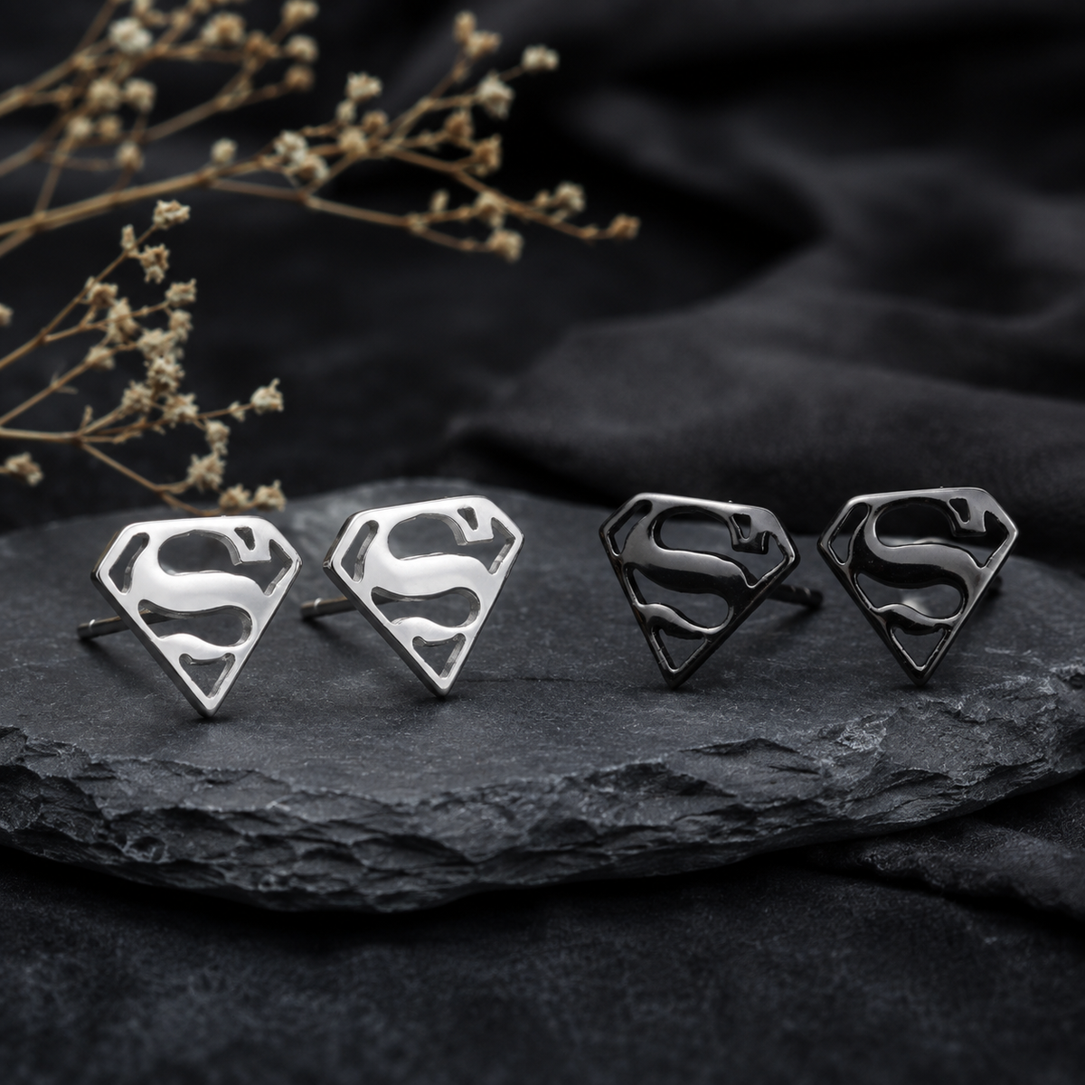 Superman-inspired S shield stud earrings in polished sterling silver and black finishes perfect unisex gothic gift for comic fan or super hero lovers