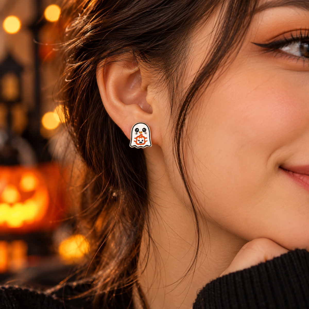 Cute ghost stud earrings with enamel, black and orange details. Spooky Halloween jewelry, kawaii earrings and a fun ghost lover gift for girls