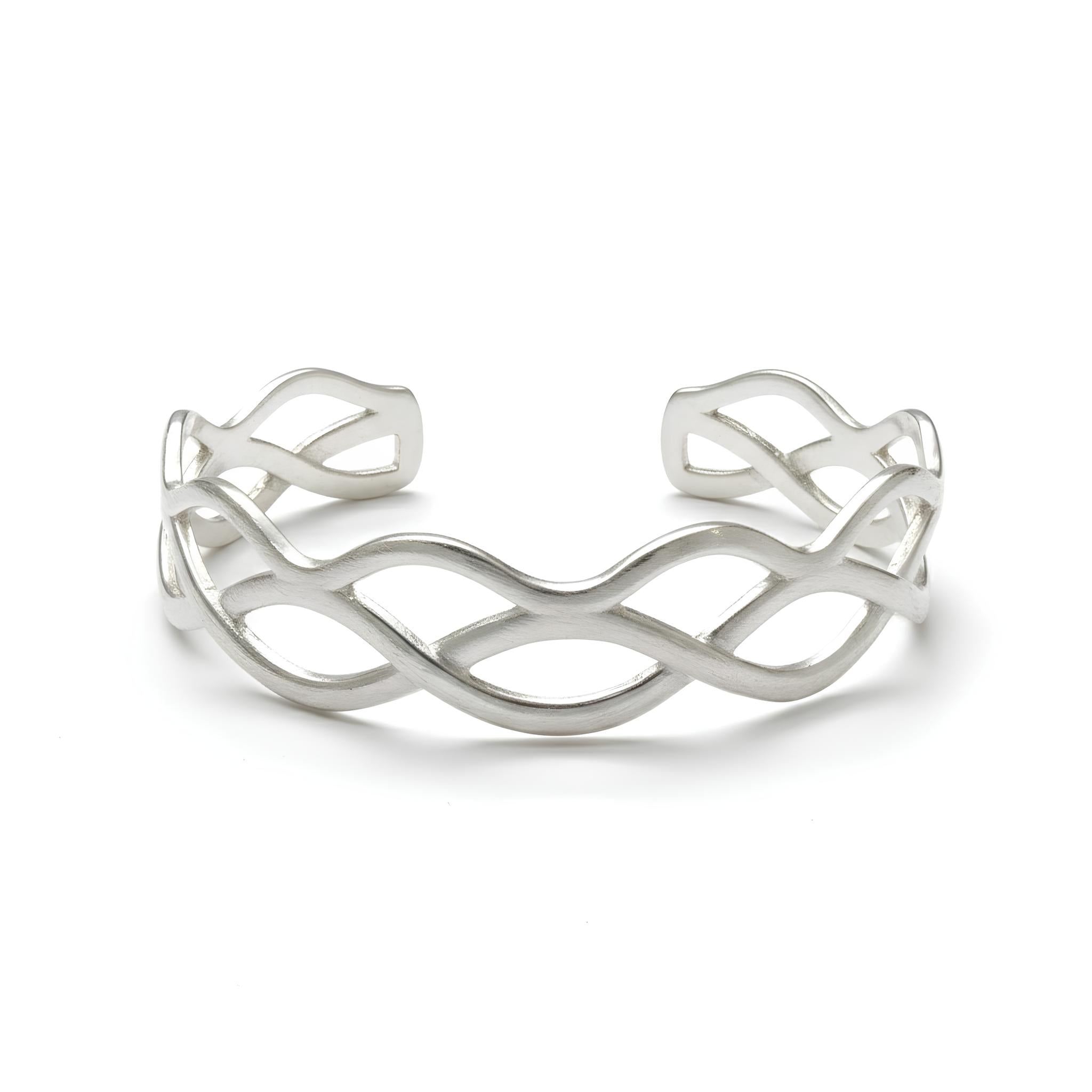 Model wearing interwoven silver cuff bracelet