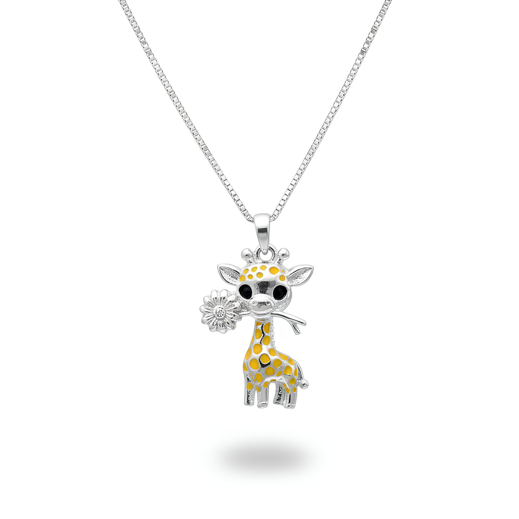 Model wearing silver and enamel giraffe pendant with black eyes