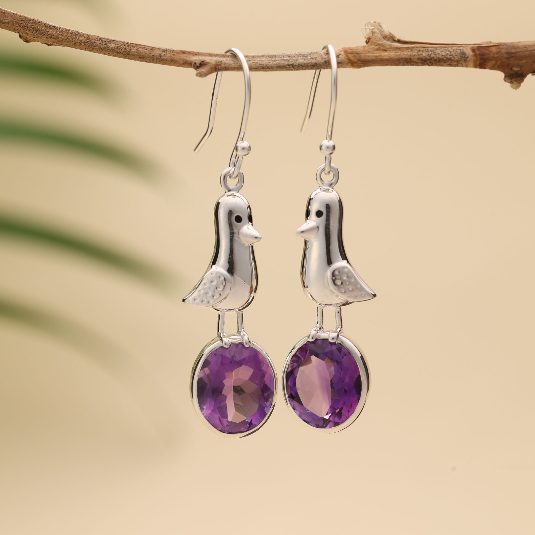 Sterling silver bird earrings with oval amethyst gemstones