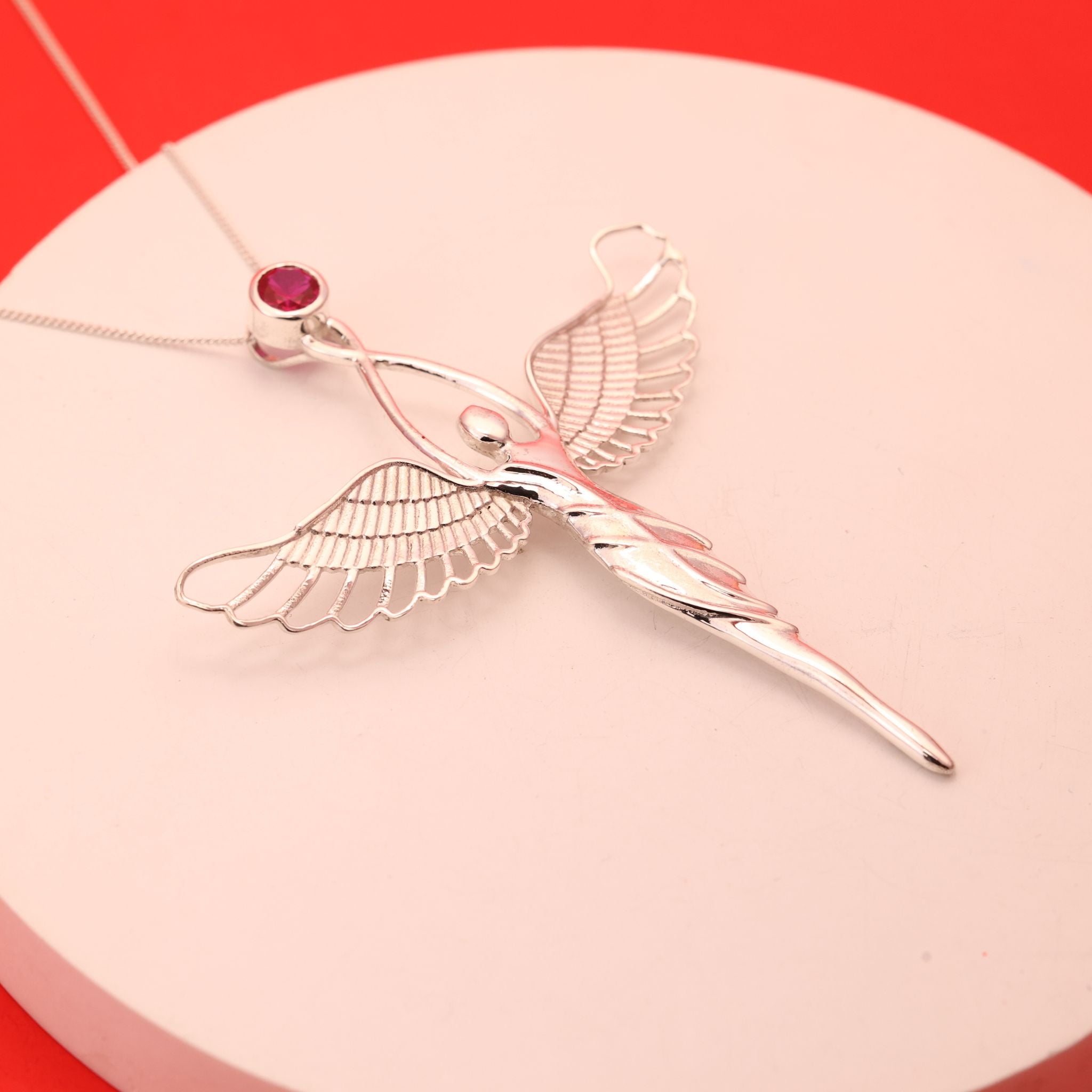 Angel pendant with ruby gemstone crafted in 925 sterling silver