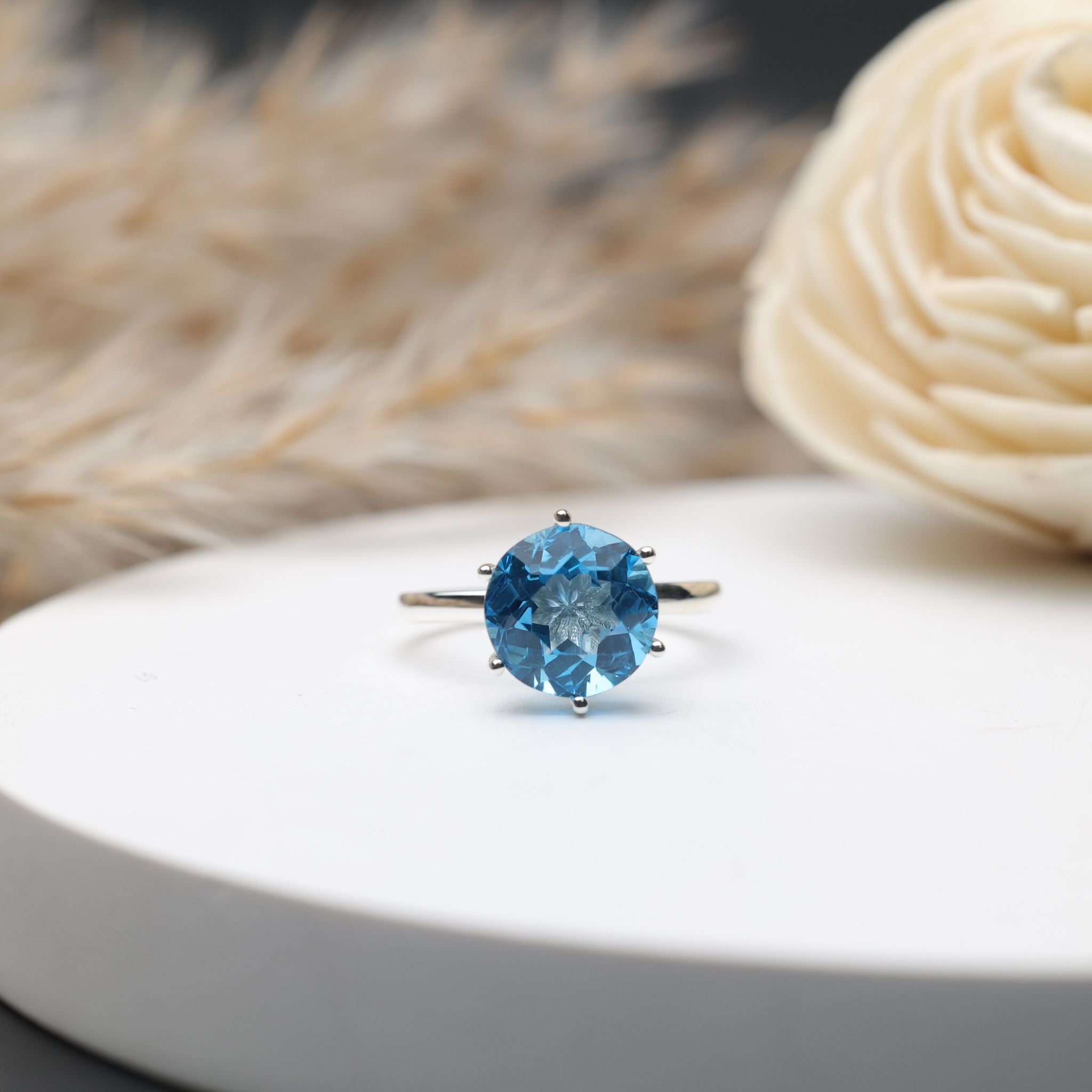 Round Swiss blue topaz solitaire ring in 925 sterling silver