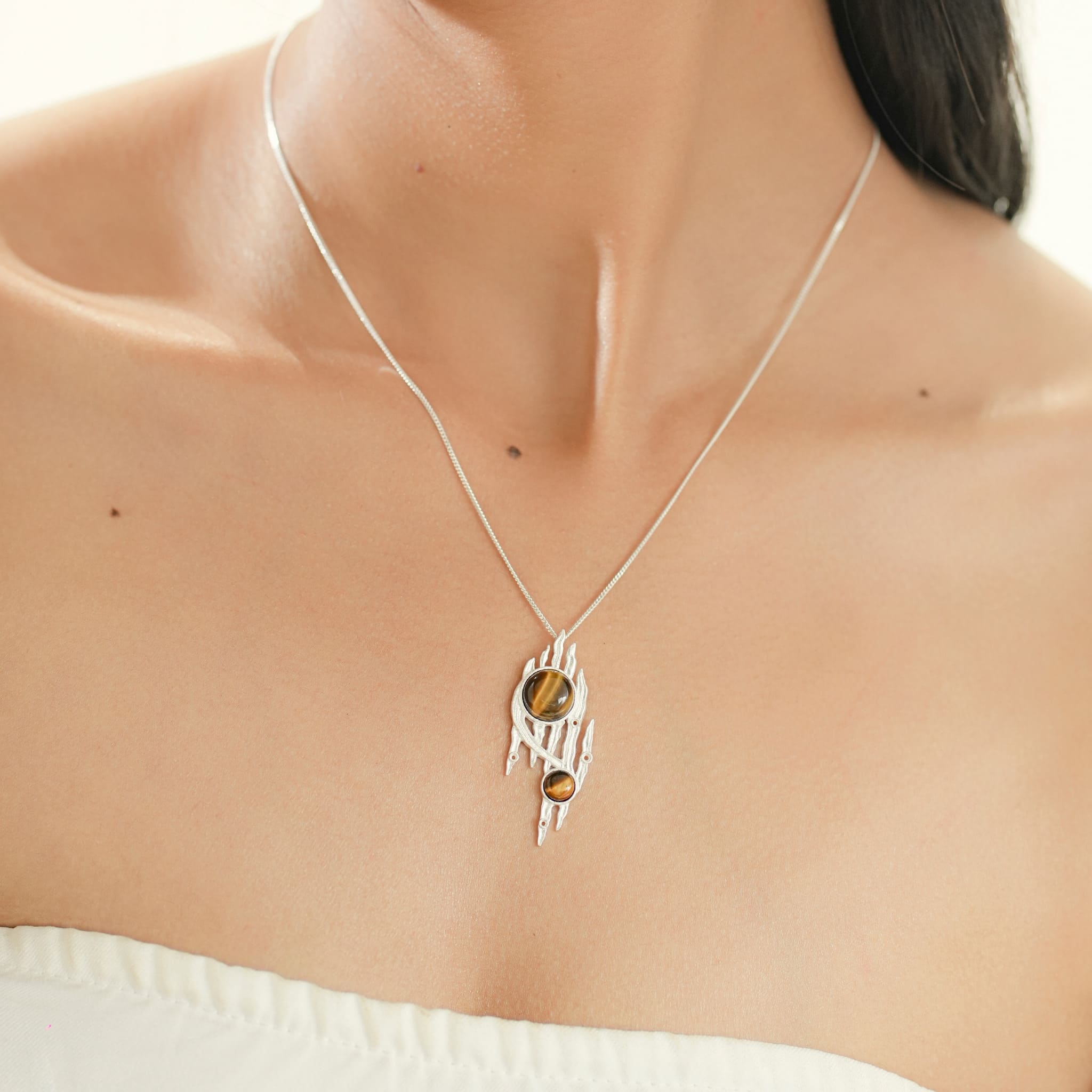 Model wearing silver Lord of the Rings pendant