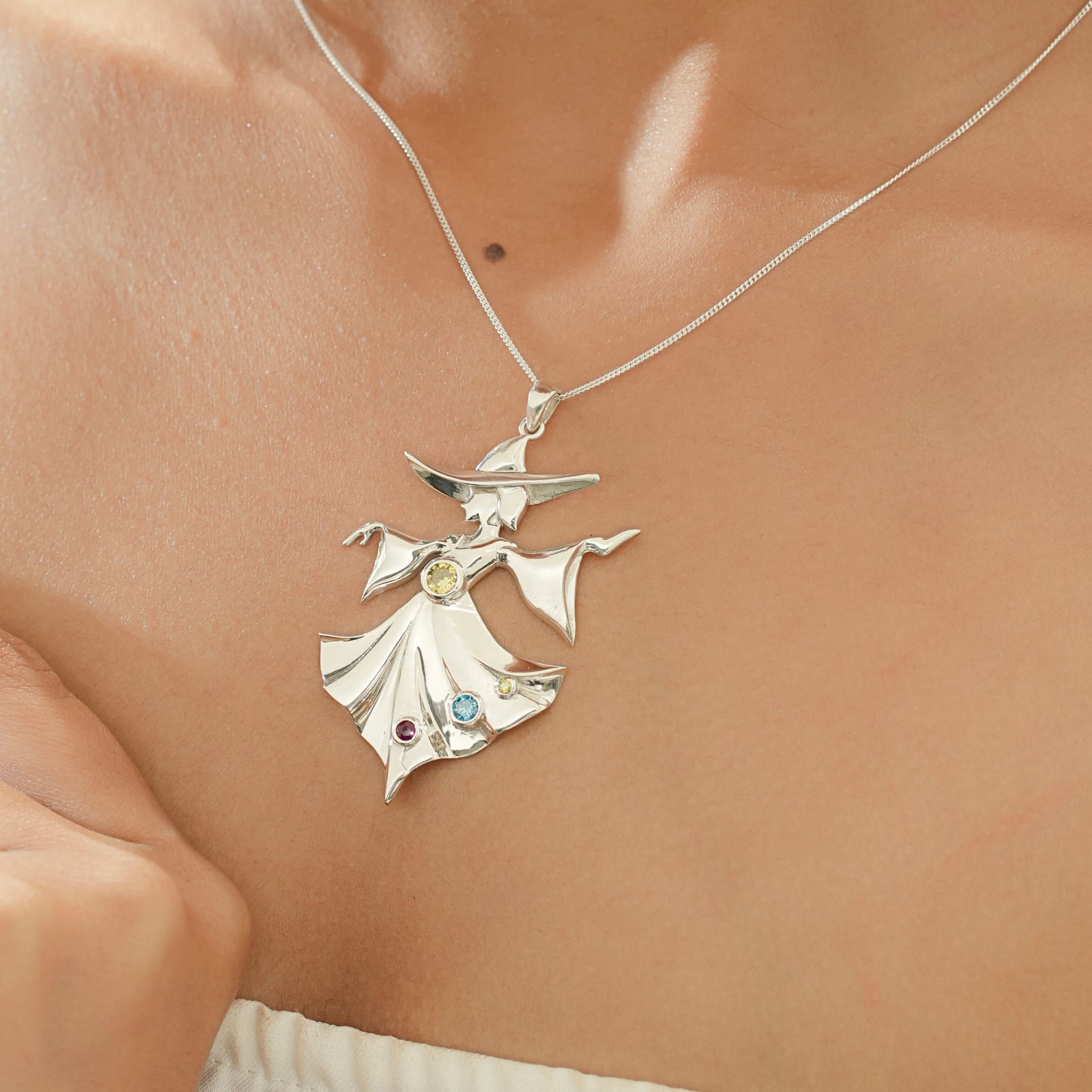 Model wearing silver Dancing Muse pendant