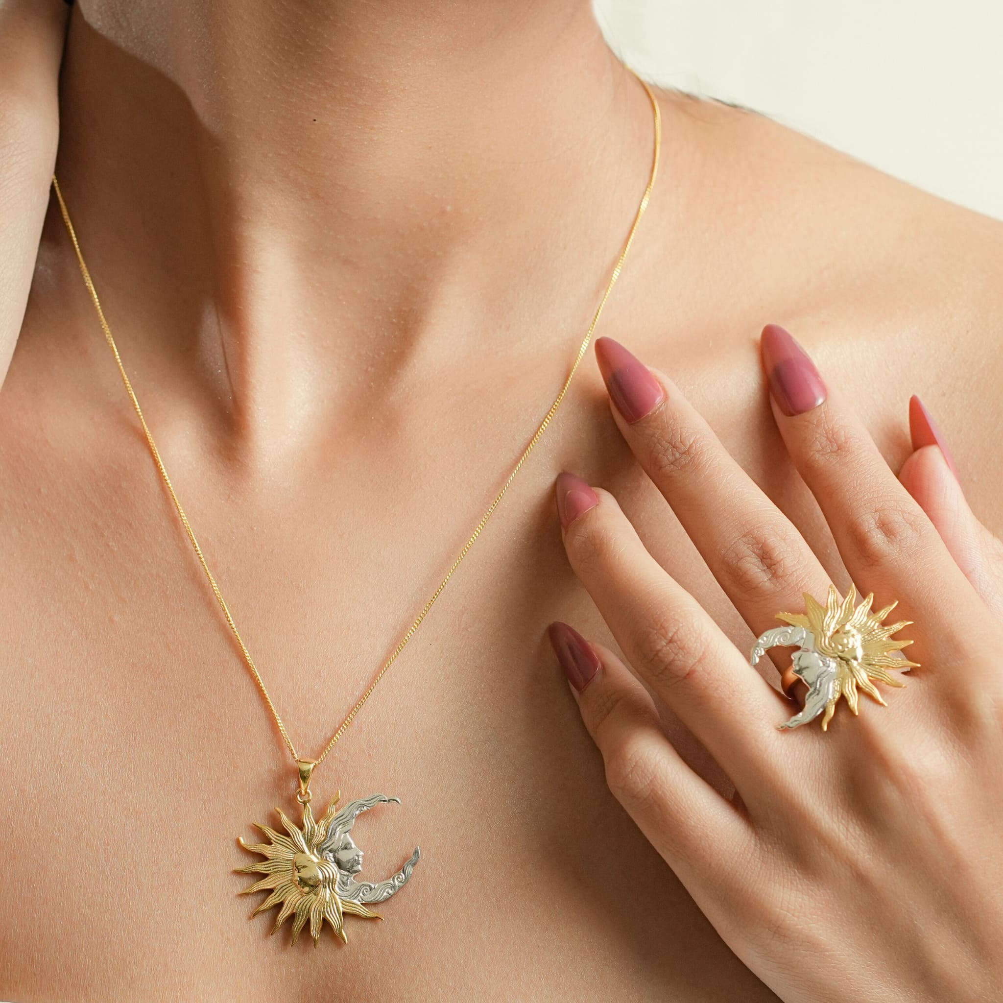 Model wearing silver and golden plated sunmoon ring and pendant