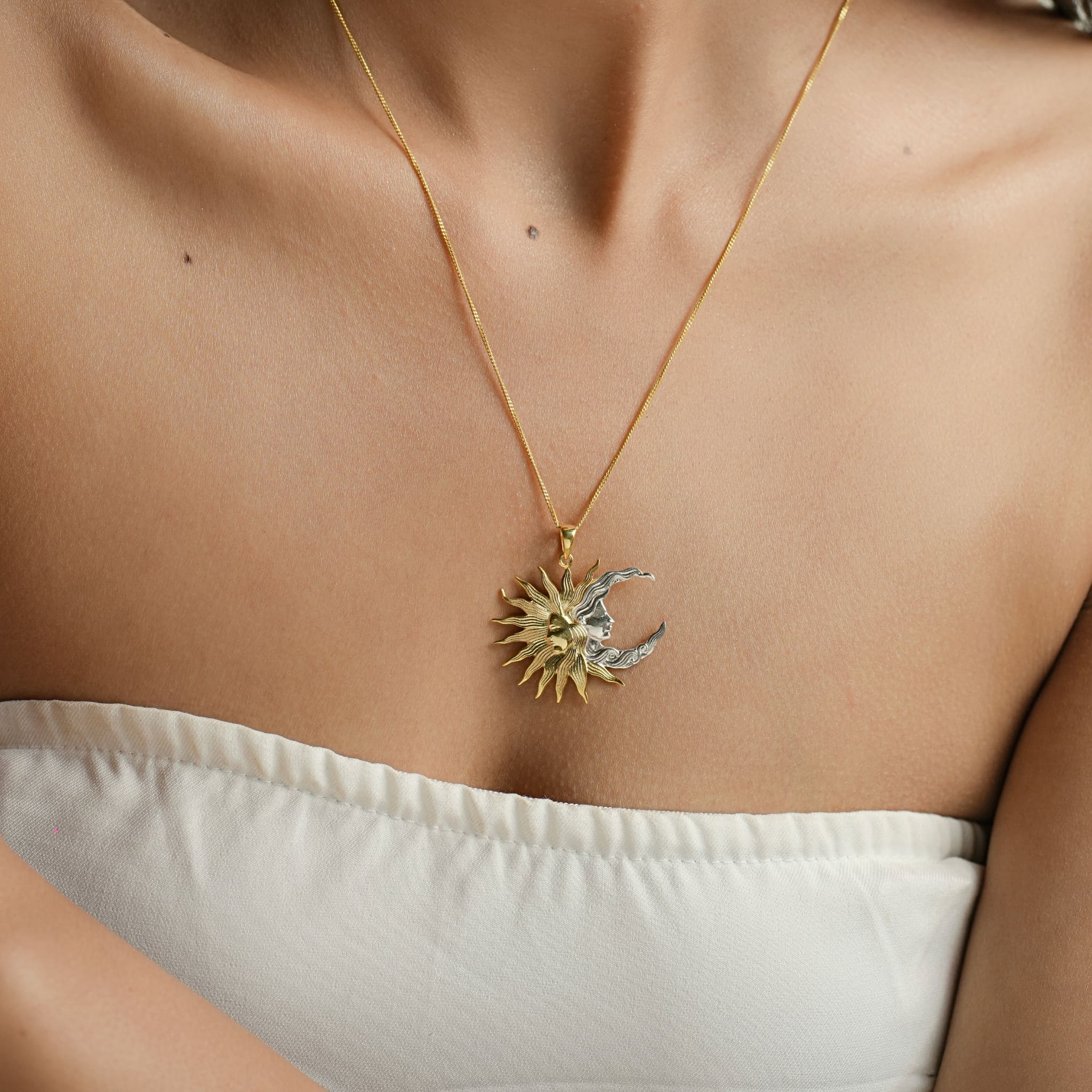 Model wearing silver and golden plated sunmoon ring and pendant