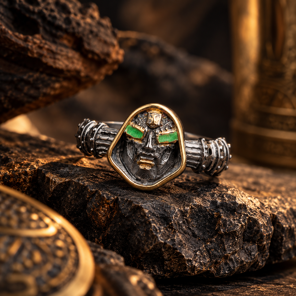 Doom Mask Ring with green eye accents, gothic detailing and industrial design. Bold men’s statement ring for punk, biker and dark fantasy style.